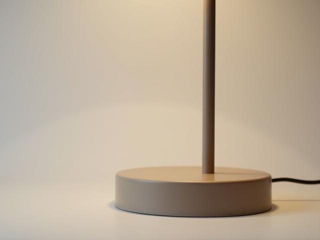 Close-up shot of the base and stem of a modern smart lamp, highlighting its clean design and premium texture.
